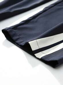 复古拼接侧条纹运动裤，男士休闲宽松直筒裤，实用风格，春秋