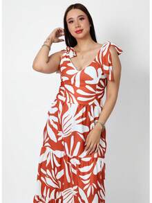 Maxivestido largo para mujer con estampado floral colorido y romántico, diseño moderno con escote en V profundo que estiliza el cuello, tirantes delgados ajustables que se adaptan perfectamente a los hombros, corte con cintura alta que alarga visualmente la figura, pastelones amplios que aportan fluidez y movimiento al caminar; ideal para mujeres jóvenes y señoras con estilo que buscan un look femenino, fresco y versátil. Perfecto para primavera, verano, vacaciones, playa, brunch, cenas o eventos casuales. Confeccionado en tela ligera y cómoda, suave al tacto y fresca para climas cálidos. Este vestido largo floral bohemio es un must-have en tu armario, combinable con sandalias, sombrero o accesorios trendy. Moda femenina para todos los días con un toque chic y romántico. - Naranja Quemada - Ver 2