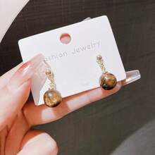 1 par de pendientes de piedra con forma de ojo de gato de estilo vintage sencillo, de moda y versátil para uso diario