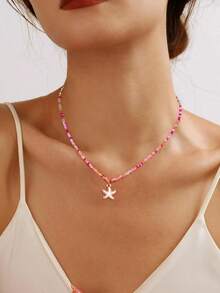 时尚的粉色手工串珠海星滴油项链混合了 Caimi 珠子，适合女士休闲和度假穿着。