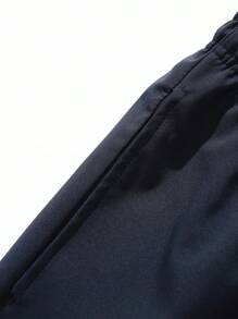 复古拼接侧条纹运动裤，男士休闲宽松直筒裤，实用风格，春秋