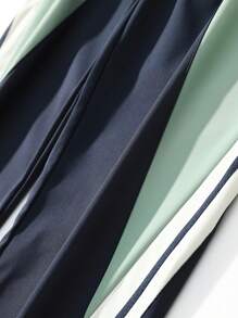 复古拼接侧条纹运动裤，男士休闲宽松直筒裤，实用风格，春秋