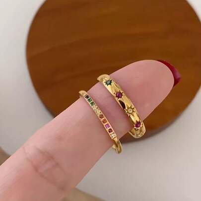 Set de regalo de 2 anillos con circonita cúbica arcoíris y estrellas doradas impermeables, estilo INS