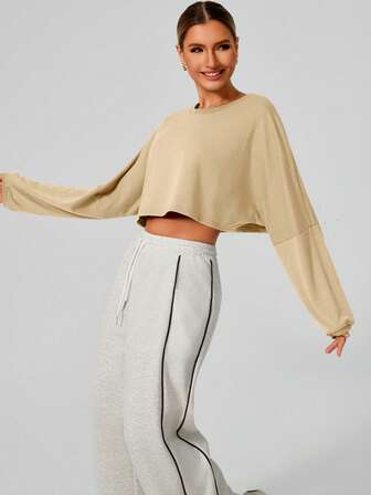 Sudadera de mujer de manga larga, moda corta y suave, parte superior de punto expuesta, cuello redondo cómodo para yoga, deportes y uso al aire libre en otoño/invierno