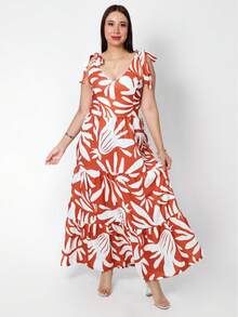 Maxivestido largo para mujer con estampado floral colorido y romántico, diseño moderno con escote en V profundo que estiliza el cuello, tirantes delgados ajustables que se adaptan perfectamente a los hombros, corte con cintura alta que alarga visualmente la figura, pastelones amplios que aportan fluidez y movimiento al caminar; ideal para mujeres jóvenes y señoras con estilo que buscan un look femenino, fresco y versátil. Perfecto para primavera, verano, vacaciones, playa, brunch, cenas o eventos casuales. Confeccionado en tela ligera y cómoda, suave al tacto y fresca para climas cálidos. Este vestido largo floral bohemio es un must-have en tu armario, combinable con sandalias, sombrero o accesorios trendy. Moda femenina para todos los días con un toque chic y romántico. - Naranja Quemada - Ver 3