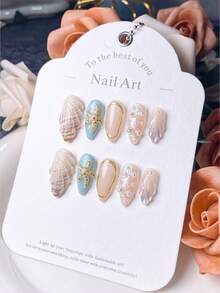 体验清新海洋美甲 | 10 件手工按压式指甲 | 杏仁形指甲，饰有贝壳和海星细节 | 附赠指甲套装（锉刀 + 果冻胶）| 适合女性海滩度假和夏季外出 | 美甲用品