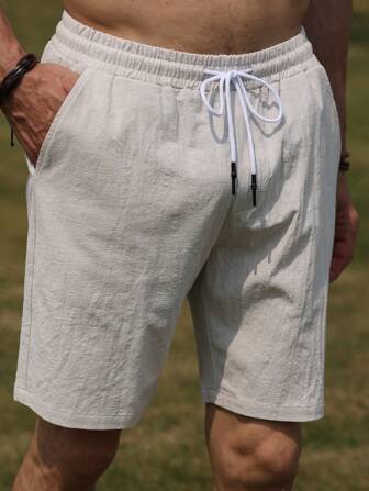 1 件男士纯色松紧腰亚麻抽绳口袋宽松休闲短裤，适合夏季穿着