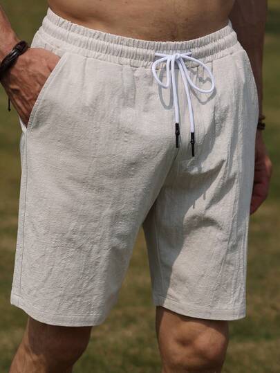 1 件男士纯色松紧腰亚麻抽绳口袋宽松休闲短裤，适合夏季穿着