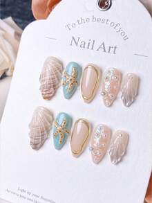 体验清新海洋美甲 | 10 件手工按压式指甲 | 杏仁形指甲，饰有贝壳和海星细节 | 附赠指甲套装（锉刀 + 果冻胶）| 适合女性海滩度假和夏季外出 | 美甲用品