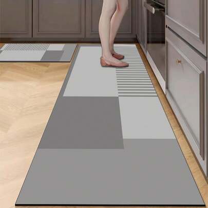 1 块硅胶厨房垫，几何拼布图案，由不同深浅的灰色方形和矩形块组成，设计时尚奢华，可缓冲和缓解厨房疲劳，表面织物材料带有吸水海绵中间