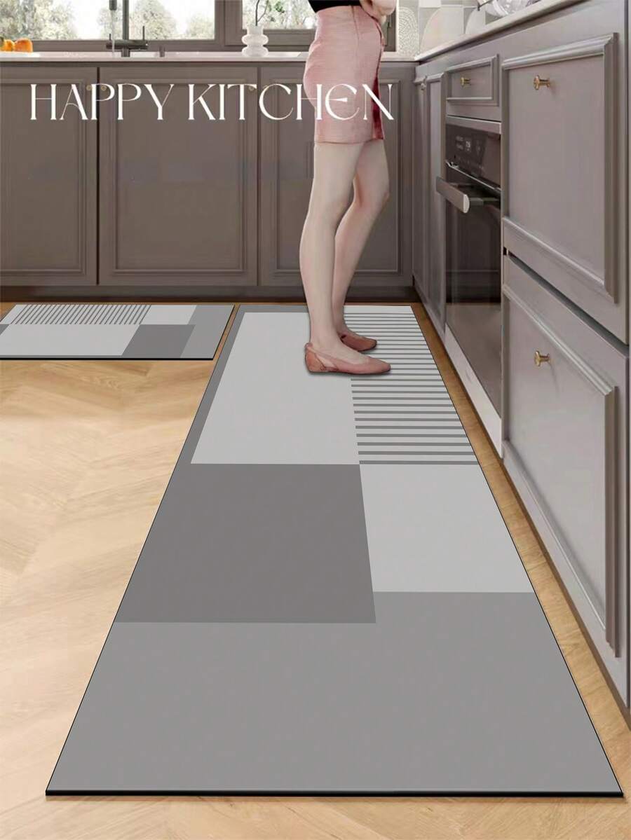 1 块硅胶厨房垫，几何拼布图案，由不同深浅的灰色方形和矩形块组成，设计时尚奢华，可缓冲和缓解厨房疲劳，表面织物材料带有吸水海绵中间