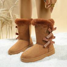 Botas de nieve de media pantorrilla con lazo elegante para mujer, botas casuales versátiles de moda con forro de piel y suela de Thick para la calidez