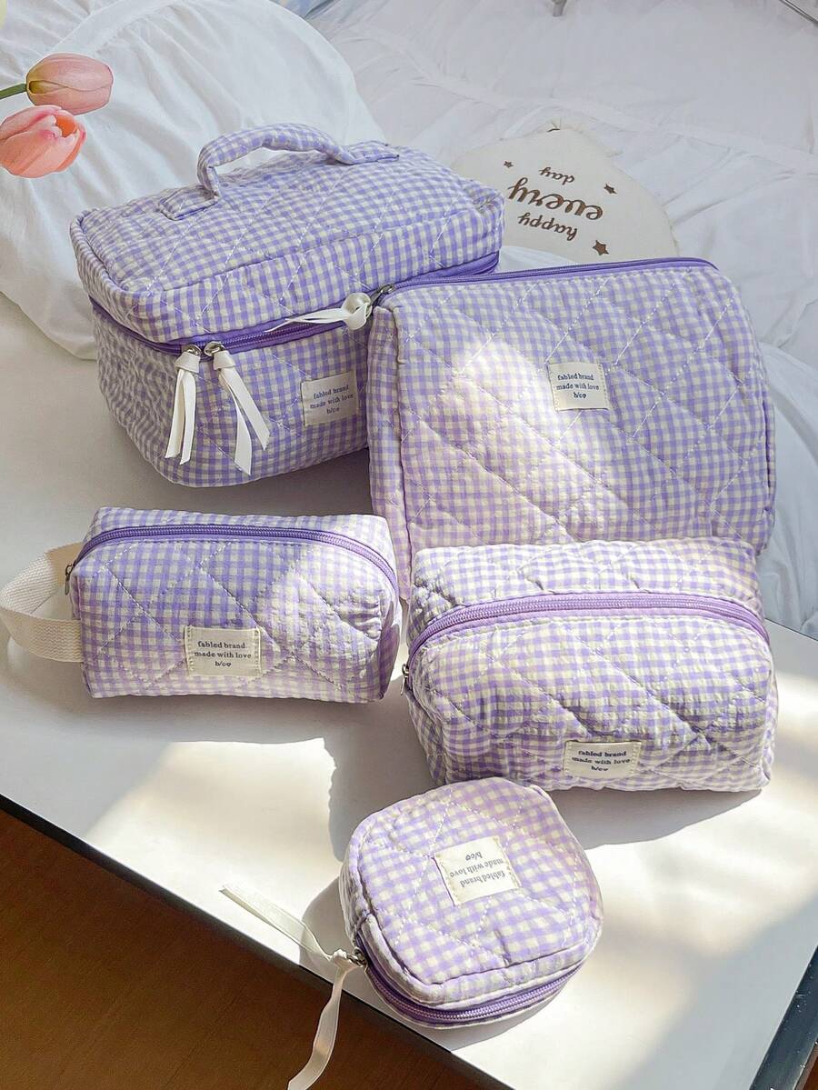 大容量家居收纳整理套装，包含拉链便携旅行洗漱包、经典紫色格子化妆包、柔软绗缝手提包、时尚撞色带提手化妆包、迷你方形卫生巾收纳袋、多功能家居收纳包、女士化妆包、旅行化妆包，是情人节、圣诞节、感恩节、伴娘婚礼的理想礼物。 - 紫色 - 查看 1