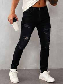 Jeans skinny para hombre en denim negro, con detalles de roturas, estilo urbano y moderno - Negro - Ver 3
