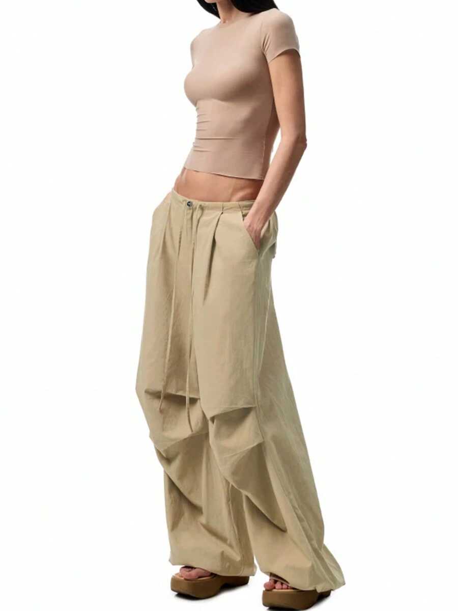 轻盈夏季宽松褶裥阔腿哈伦裤，做旧水洗效果，女士休闲日常穿着