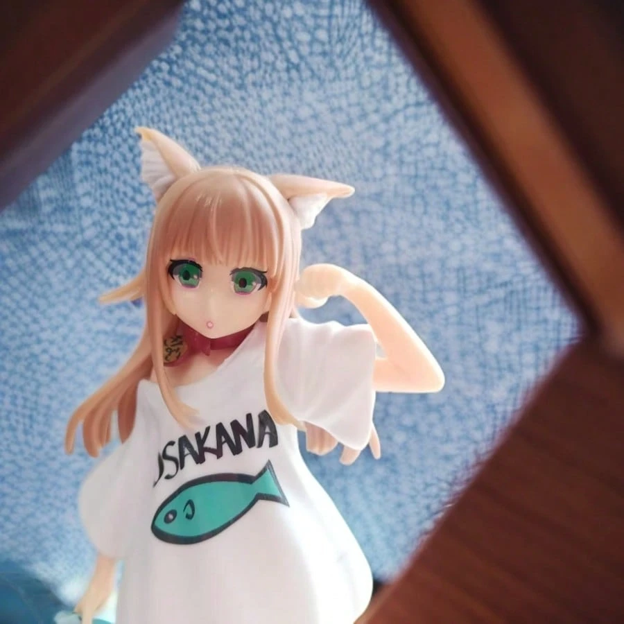 Resin figure of an anime-style cat girl, 18 cm tall, wearing a white dress with a fish design and holding a shark plush toy.
