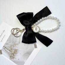 18/3件/套 优雅黑色蝴蝶结钥匙扣套装，适用于手机、包包、钥匙、汽车、耳机挂件，是分发节日派对用品、赠送亲朋好友、婚礼祝福、生日和其他重要节日的完美之选。 - 黑色蝴蝶結 - 查看 8