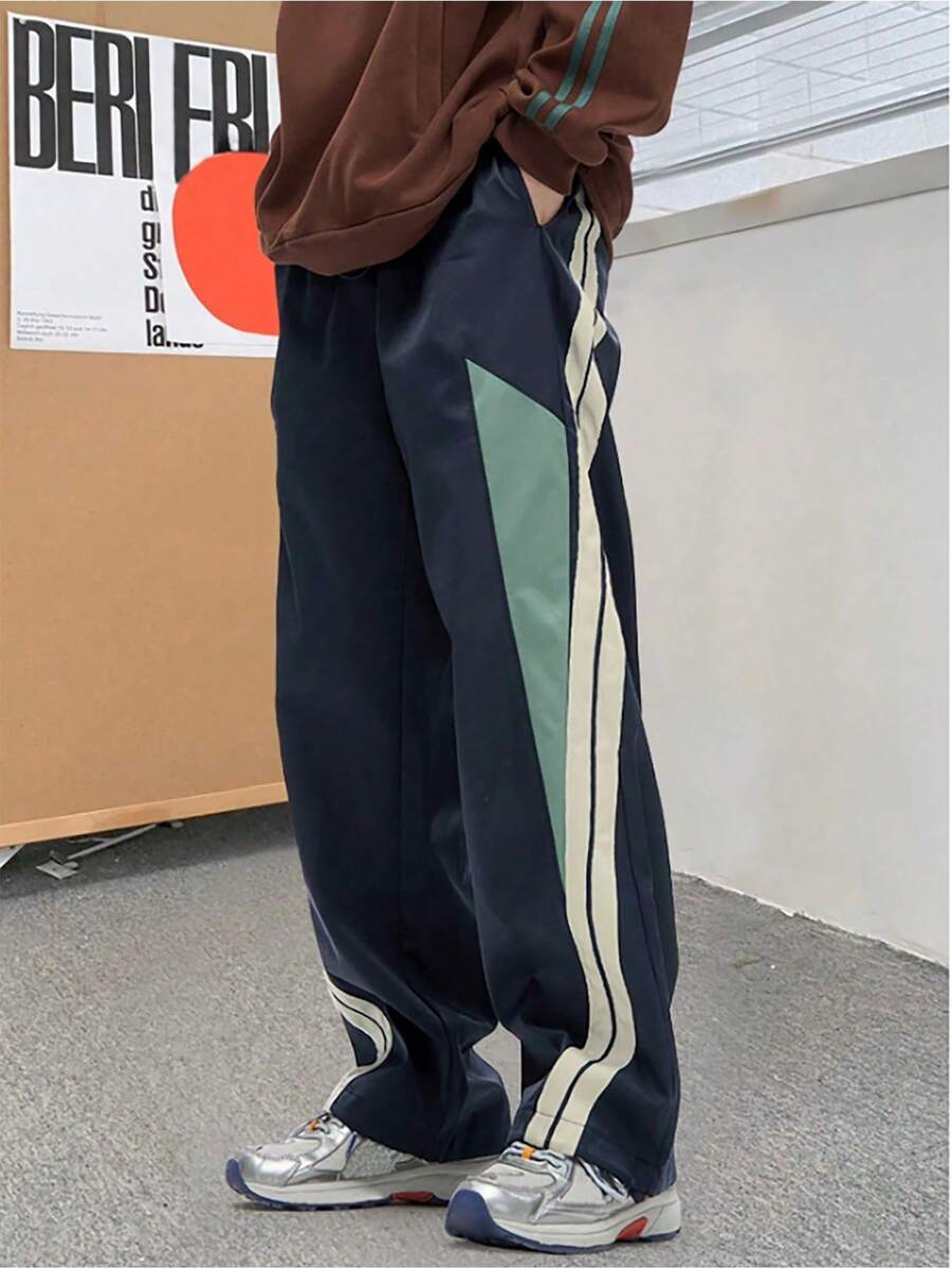 青少年男款寬鬆時尚長褲，抽繩腰身，輕量聚酯纖維，四季日常穿著