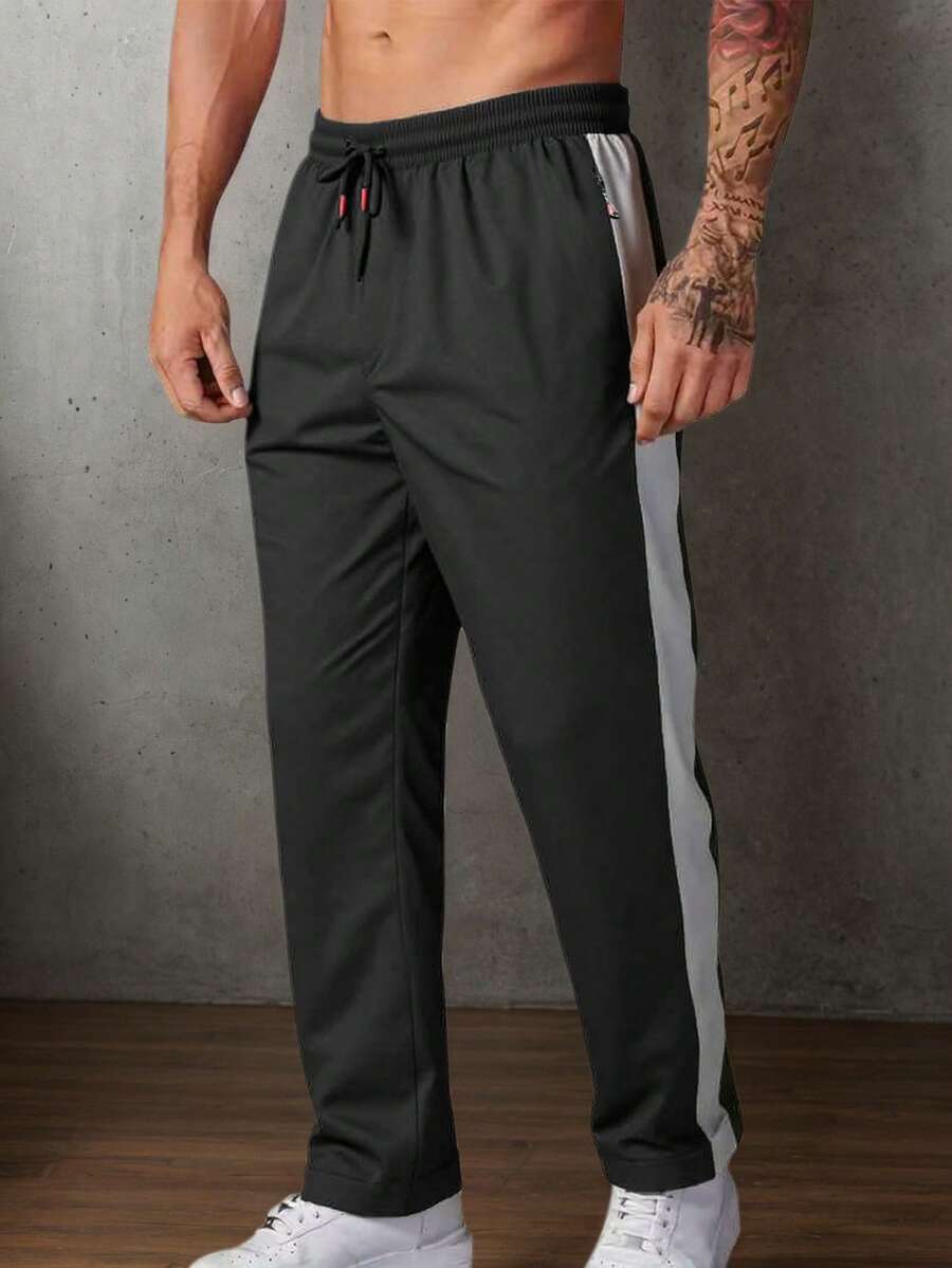 男士休闲运动宽松户外裤，彩色拼布，拉链口袋，尼龙面料，适合户外休闲运动 - 黑色 - 查看 1