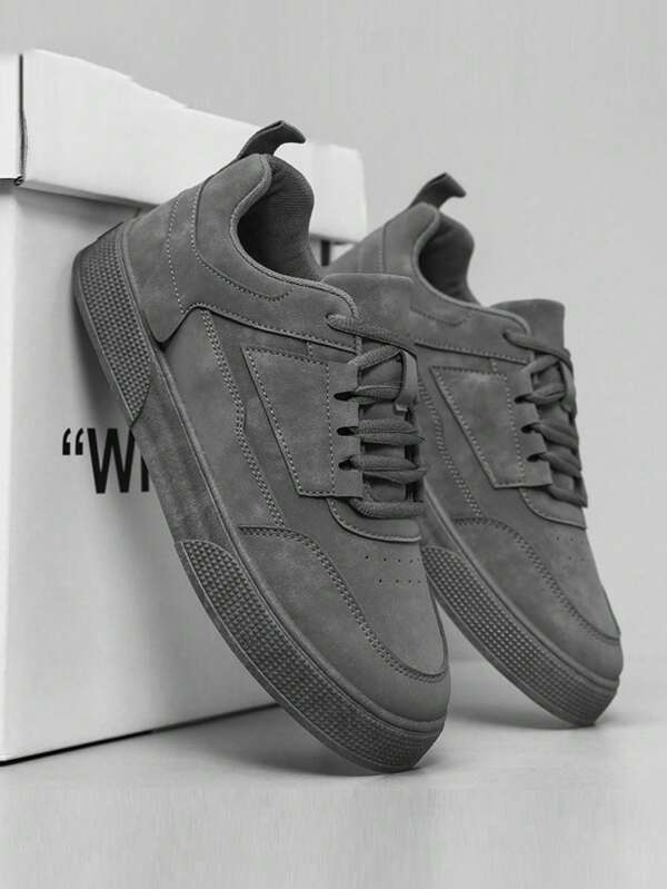 Chaussures de skateboard sport à lacets gris unicolore pour hommes, style minimaliste avec bout rond et semelle épaisse, hauteur augmentée (taille 1 pointure plus petite)