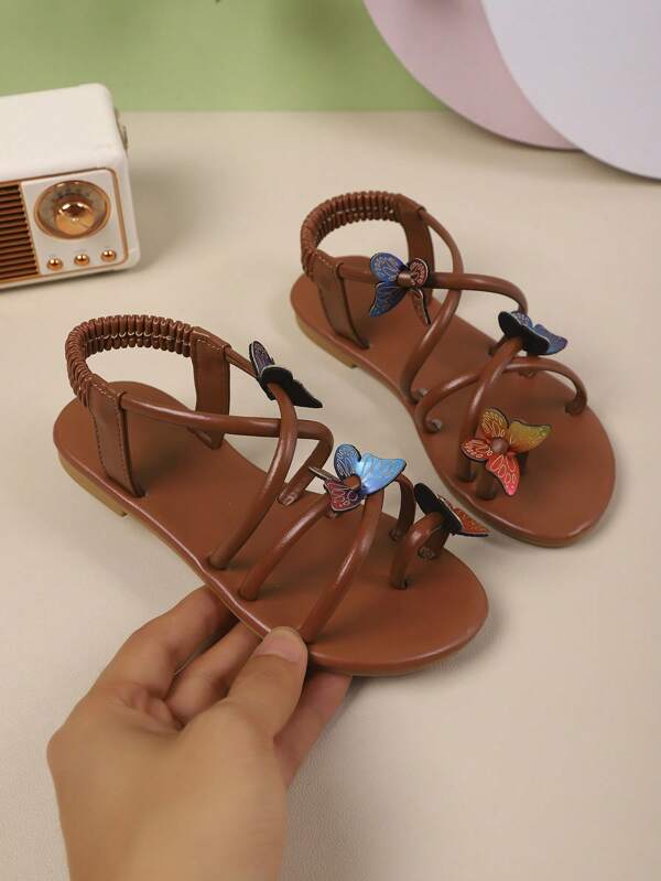 A Pair Of Girl's Sandals 2025 Summer New Style, Fashionable And Versatile, Round-Toed Flat, Anti-Slip, Fashionable And Versatile, Round-Toed, Gold, Brown, Printed, Butterfly, Colorful, Anti-Slip, Toe Exposed, Beach, Outerwear Sandals