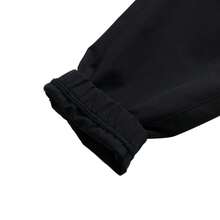 Under Armour Pantalones jogger tejidos Icon, pantalones de entrenamiento de ajuste holgado con cordón en la cintura, 6000663 - Negro - Ver 4