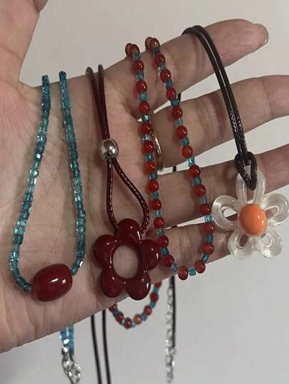 1 件精致花朵吊坠项链镂空花朵吊坠项链，带可调节结树脂材质，非常适合婚礼直销