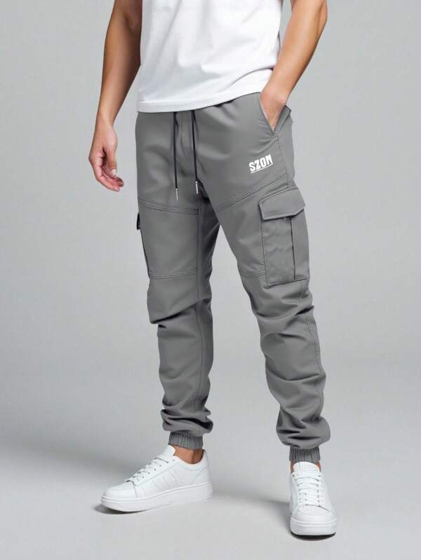 Herren Lässig lang geschnittene, entspannte Freizeithose in Grau, Geschenkidee für Ehemann oder Freund, mit Buchstabenprint-Design, Kordelzugbund, weite Freizeithose, lange schwarze Farbe für den Outdoor-Gebrauch