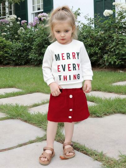 Conjunto de dos piezas para niñas pequeñas para otoño: jersey de manga larga con estampado de letras y falda acampanada de color liso con botones.