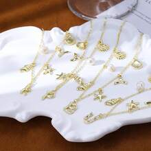 CAROVO Gold Initial Charm Necklace Women Letter A-Z Necklace 14K Gold Plated Charm Pendant Necklace Boho Summer Seashell Beach Starfish Surfer Jewelry - b - Xem 9