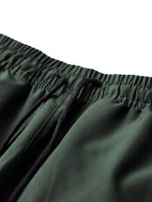 بنطلون رجالي للتنزه في الربيع والخريف مع جيوب سحاب وسحاب، بنطلون مستقيم للركض اليومي مع تسليط الضوء على اللون النيون اللافت