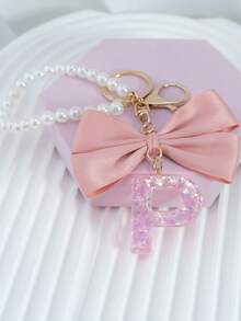 三件套：闪亮粉色洋葱亮片、26个树脂大写英文字母、18K镀金龙虾扣扁环链，搭配时尚粉色布艺蝴蝶结和仿珍珠串珠装饰配件，适用于包包链、手机挂绳、钥匙扣，也可作为礼物送给朋友、母亲、车饰、包包挂饰、背包挂件、带证件夹的挂绳、汽车装饰、圣诞汽车饰品、老师、姐妹等。 - 粉色 - 查看 23