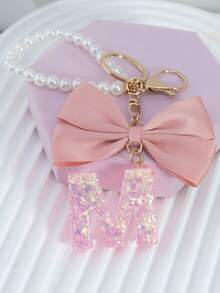 三件套：闪亮粉色洋葱亮片、26个树脂大写英文字母、18K镀金龙虾扣扁环链，搭配时尚粉色布艺蝴蝶结和仿珍珠串珠装饰配件，适用于包包链、手机挂绳、钥匙扣，也可作为礼物送给朋友、母亲、车饰、包包挂饰、背包挂件、带证件夹的挂绳、汽车装饰、圣诞汽车饰品、老师、姐妹等。 - 粉色 - 查看 28
