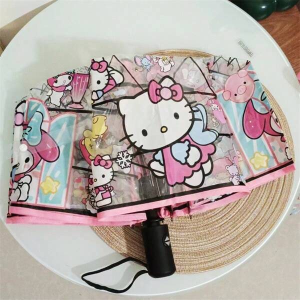 Sanrio Hello Kitty Kulomi Melody süßer transparenter Regenschirm - hochwertige 8-Loch manuelle 3-fach faltbare tragbare Reise-Regenschirm, automatisches und manuelles Design, rosa herzförmige Schleifengestaltung, robuster transparenter Regenschutz, Outdoor-Muss-haben, faltbares Design, kompakter und frischer Stil, unverzichtbar für Regentage, bevorzugt von Kawaii-Enthusiasten, Geburtstagsgeschenk, Halloween, Weihnachten, Reisezubehör