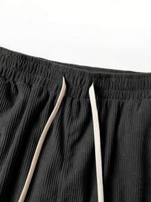 Pantaloni cargo da uomo in velluto a coste di colore unito, pantaloni con lacci e tasche multiple, pantaloni casual e larghi da esterno, pantaloni da lavoro e stile di strada da uomo