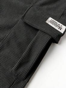 Pantaloni cargo da uomo in velluto a coste di colore unito, pantaloni con lacci e tasche multiple, pantaloni casual e larghi da esterno, pantaloni da lavoro e stile di strada da uomo