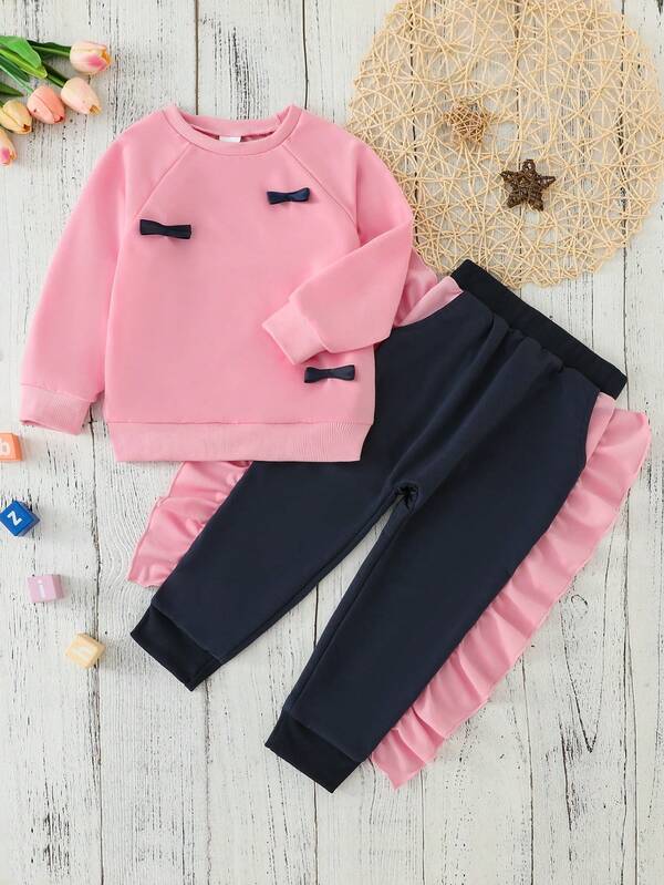 Autumn/Winter Girls' Solid Color Raglan Sleeve Round Neck Bow Decor Sweatshirt + Solid Color Patchwork Floral Trim Pocket Pants Set