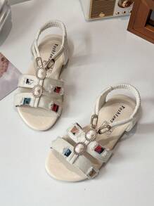 1双。适合3-12岁女孩。饰有牛仔织带。面料和合成皮革。防滑耐磨。露趾低帮。带扣平底鞋带。甜美公主风格。凉鞋。适合夏季外出和派对穿着。 - 米色 - 查看 3