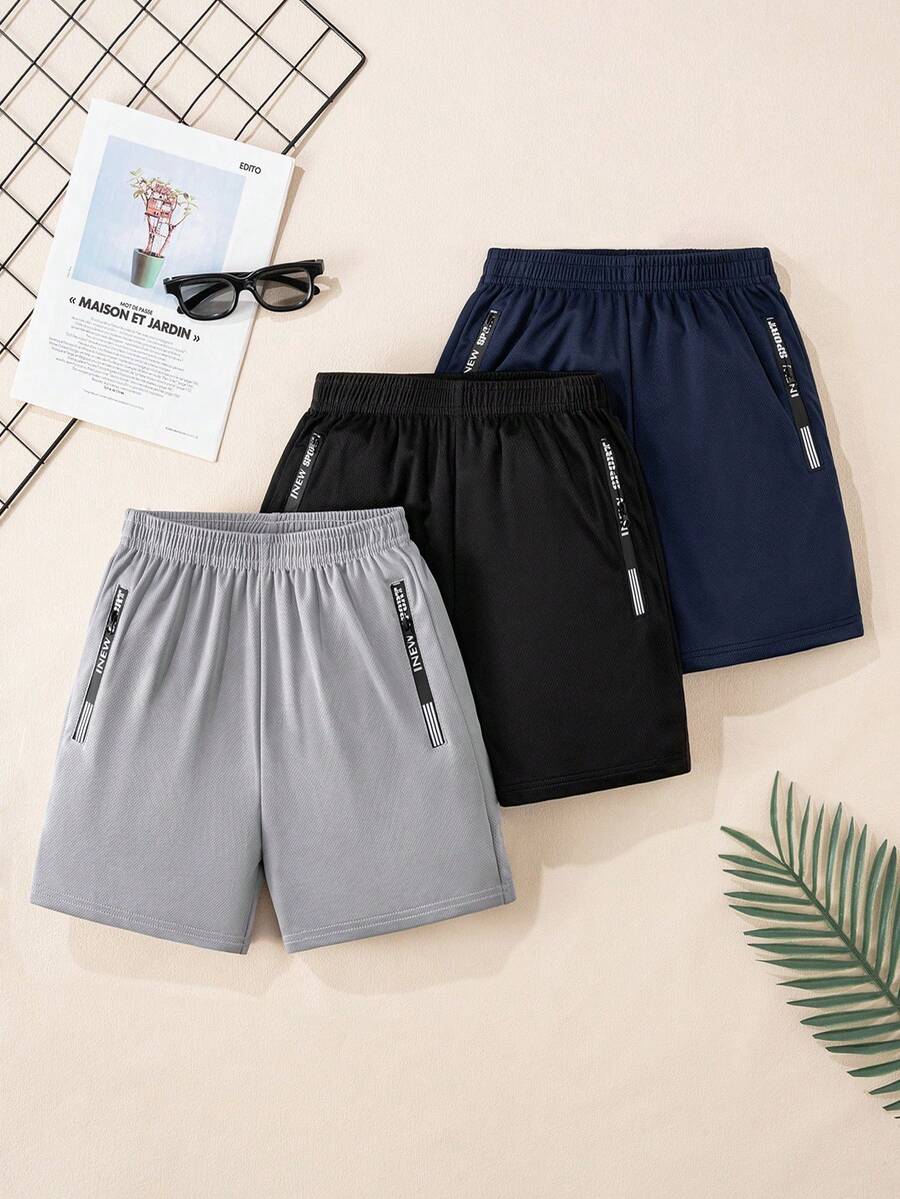 Tween-Jungen 3-teiliges Paket mit lässigen Sportshorts aus Netzstoff mit Grafikdruck und Reißverschlusstasche, geeignet für das tägliche Training, Basketballaktivitäten und den Urlaub - Verschiedenfarbig - Übersicht 1