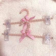 1/2/5 Piezas de colgador de perlas falsas con un lazo, pinza de pantalones de perlas falsas y colgador para mascotas. El soporte para colgar ropa es adecuado para colgar prendas de estilo hada como vestidos, pantalones, zapatos, jeans, botas y faldas.