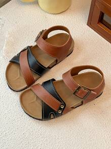 This Is A Pair Of Best-Selling Girls' Sandals. The Upper Is Made Of Brown And Black Leather. The Cross-Strap Design Adds A Sense Of Layering, And It Is Equipped With Metal Buckles To Adjust The Tightness. It Is Convenient To Put On And Take Off. The Upper Layer Of The Sole Is Made Of Cork, Which Fits The Feet Closely And Provides Comfort.