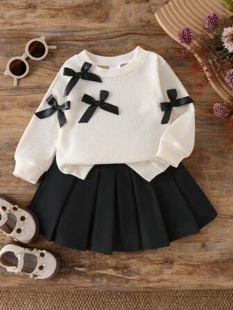 2pcs/Set Baby Girl Black Bow Decor Round Neck Long Sleeve Top Casual Shirt And Pleated Skirt Suit