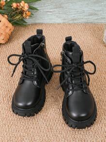 This Is A Pair Of Short Boots. The Upper Material Looks Like Leather. It Adopts A Design With Laces And A Side Zipper, Which Is Convenient For Children To Put On And Take Off. The Sole Is Thick With Obvious Patterns, Enhancing The Grip And Stability Of The Shoes.