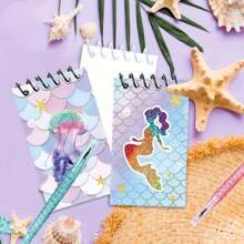 16件套美人鱼主题派对礼盒套装 - 包括8本海洋主题笔记本和8支美人鱼笔，笔身饰有海星图案和鲜艳的美人鱼插图，采用塑料和纸质材料，非常适合生日、海滩装饰和美人鱼主题庆祝活动，是美人鱼派对装饰的理想之选。 - 彩色 - 查看 3
