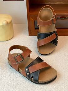 This Is A Pair Of Best-Selling Girls' Sandals. The Upper Is Made Of Brown And Black Leather. The Cross-Strap Design Adds A Sense Of Layering, And It Is Equipped With Metal Buckles To Adjust The Tightness. It Is Convenient To Put On And Take Off. The Upper Layer Of The Sole Is Made Of Cork, Which Fits The Feet Closely And Provides Comfort.