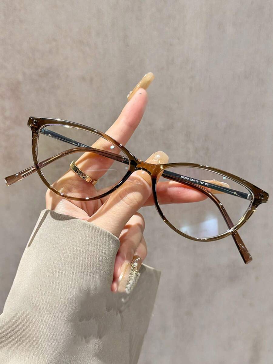 一副复古红色猫眼框眼镜，女士小镜框，透明镜片，时尚别致，Y2K风格，无度数，休闲正装皆宜，配饰，独特设计，高品质
