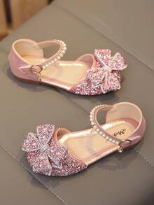 1 Đôi dép xăng đan đế bằng màu hồng thời trang mới, đa năng, đính ngọc trai và nơ đá lấp lánh cho bé gái, mũi tròn, thích hợp cho mang hàng ngày, khiêu vũ, hoạt động ngoài trời mùa xuân và mùa thu, giày công chúa mũi kín đính kim tuyến, size nhỏ hơn 1 size. - Hồng - Xem 5