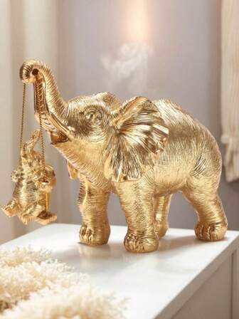 一件银色和金色大象雕像，用于室内装饰，寓意招财进宝，适合家居装饰、卧室装饰、办公室和学生，是最佳万圣节和圣诞节礼物，也是秋季生日毕业礼物