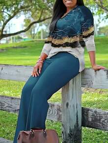 Bộ đồ nữ thường ngày cổ chữ V gồm 2 món: Áo dài tay in họa tiết và quần ống rộng, chất liệu vải co giãn vừa phải, thích hợp cho mùa xuân. - Màu xanh bạc hà - Xem 3