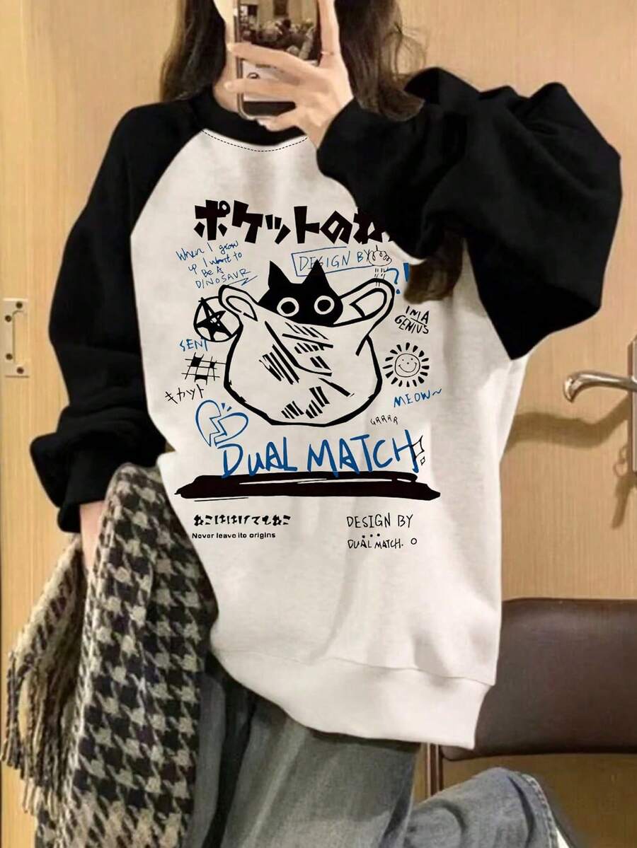 1件女童日系涂鸦猫印花插肩袖卫衣，舒适柔软，春秋季日常休闲穿着